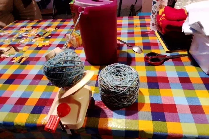 Two grey yarn balls wound on the Skeinwright ball winder, photo from a verified buyer